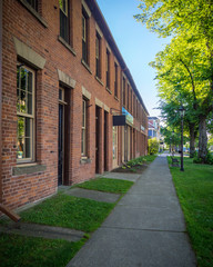 The old red brick buildings in the downtown of Charlottetown, Prince Edward Island in the early...