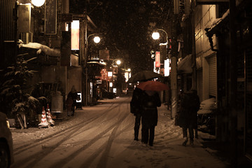 road at the night during snow fall at takayama Japan