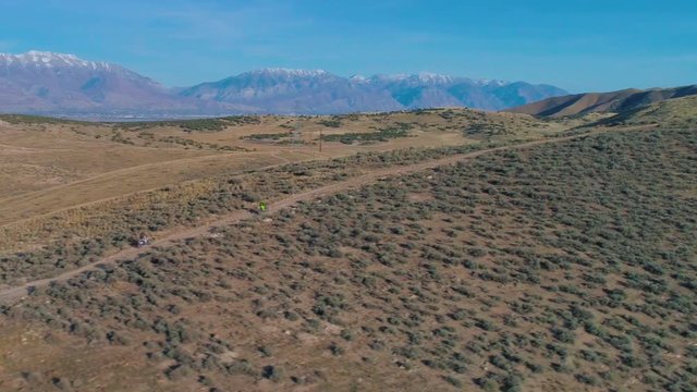 Aerial Footage of Dirt Bike Motorcycles Climbing a Mountain 