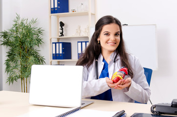 Female doctor cardiologist working in the clinic 