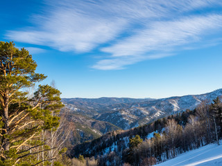 View from Tserkovka mountain to the Altai Mountains in winter in resort Belokurikha on Altai, Russia