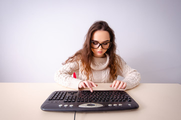 Funny nerd girl working on computer