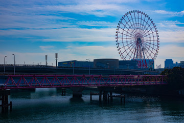 Ferris wheel behind the blue sky at the amusement park in Odaiba Tokyo