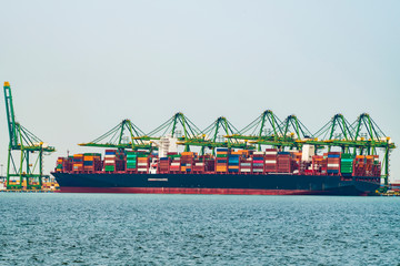 Fototapeta premium Cargo operations on a container ship in China
