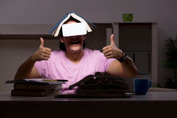 Male student with virtual glasses late at home 
