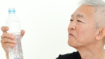 Asian senior man water bottle drink for health