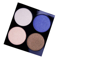 Set of four round eye shadow in a plastic black box isolated on white background
