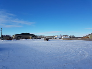 Buildings in a large snow field