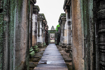 Sandstone carving with religious motifs at the ruins of the Hindu temple in Phimai historical park, Thailand.