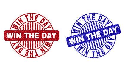 Grunge WIN THE DAY round stamp seals isolated on a white background. Round seals with distress texture in red and blue colors.