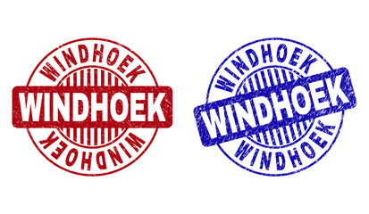 Grunge WINDHOEK round stamp seals isolated on a white background. Round seals with grunge texture in red and blue colors. Vector rubber imitation of WINDHOEK label inside circle form with stripes.
