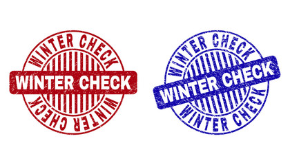 Grunge WINTER CHECK round watermarks isolated on a white background. Round seals with grunge texture in red and blue colors. Vector rubber overlay of WINTER CHECK text inside circle form with stripes.