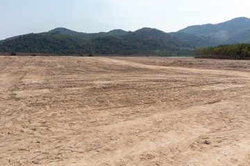 empty dirt field on sunny day at Thailand