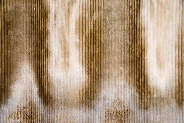 The texture of an old asbestos house roof in a village or an old