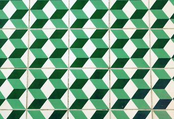 The floor of retro green tiles. Repeating geometric patterns of dice on the floor of ceramic tile.