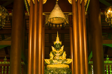 Ancient statue of the Emerald Buddha in a Buddhist temple Wat Phra Kaew