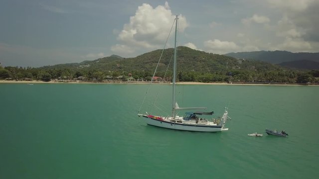 Single Mast Sail Boat - circeling with drone-Take 1- Mae Nam Beach- Koh Samui -Thailand