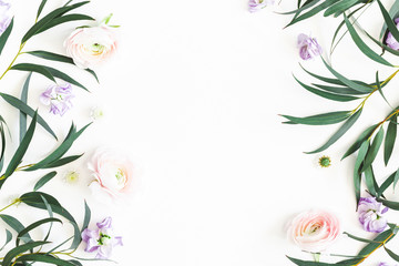 Flowers composition. Purple flowers and eucalyptus leaves on white background. Flat lay, top view, copy space