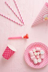 Colorful candies on pastel turquoise background. Flat lay, top view