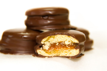 preparation of alfajores of dulce de leche bathed in chocolate