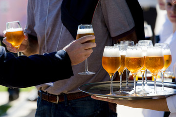 Waiter serving beer at event