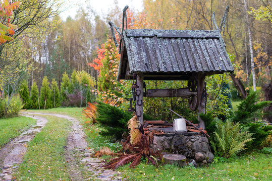 Historic well with a wooden roof farmhouse yard.