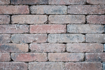 old brick wall closeup - tiled stone background