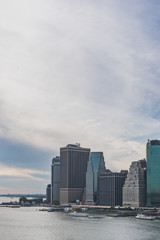 Fototapeta na wymiar Skyscrapers of downtown Manhattan over East River, viewed from Brooklyn Bridge Park, in Brooklyn, New York, USA