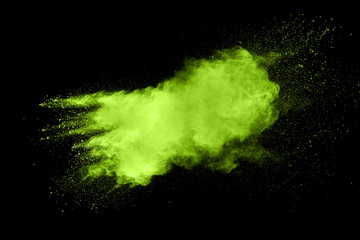 Green red color powder explosion cloud  on black background.Green red dust splash on dark background.