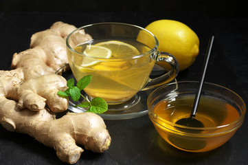 Ginger tea with lemon in glass cup