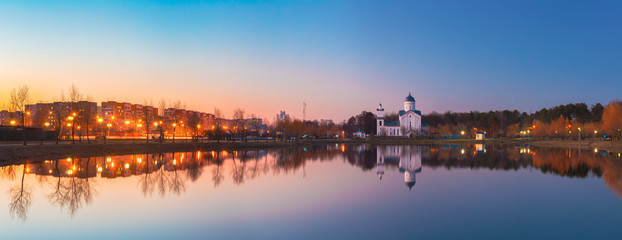 Fototapeta na wymiar Panoramic View Of Alexander Nevsky Orthodox Church Behind Illuminated City Lake, Gomel Belarus