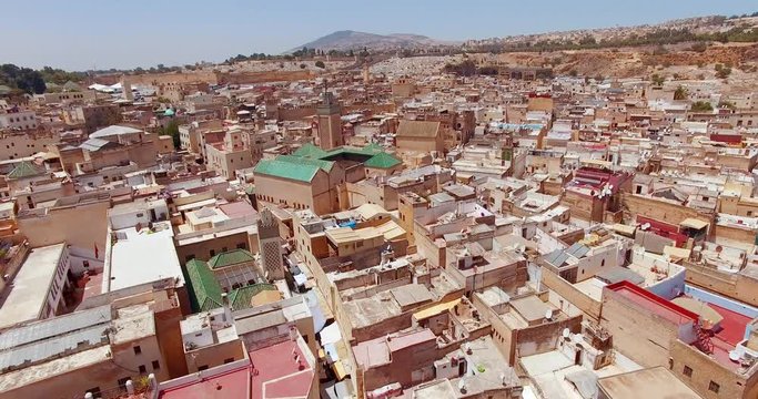 FEZ, MOROCCO. Medieval traditional architecture of the Old Fez. Drone flies above the perimeter of ancient medina.