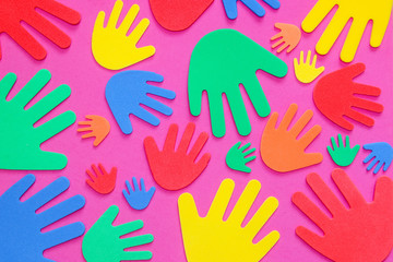 Fototapeta premium Brightly colored foam hand shapes of red, orange, yellow, green and blue