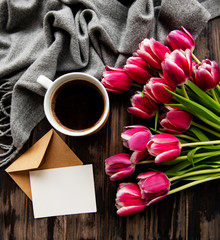 Cup of coffee and pink tulips