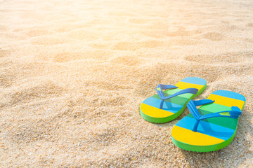 Beach sandals on the sandy coast