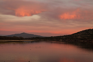 Fototapeta premium Sunset in the reservoir of Manzanares el Real, Madrid. Sierra de Guadarrama National Park
