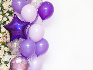 Lots of purple, pink and white balloons on white background