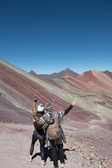 couple holding their hands in the air