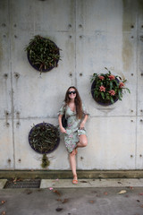 woman leaning on the wall