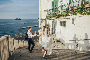 Young wedding couple having fun Time  in Italy.