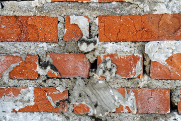 Old bricklaying of a fireplace in an abandoned house built in the middle of the last century