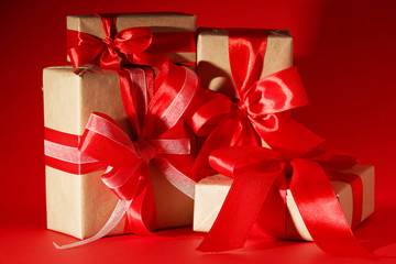 Gifts packed with craft paper and colorful satin ribbons