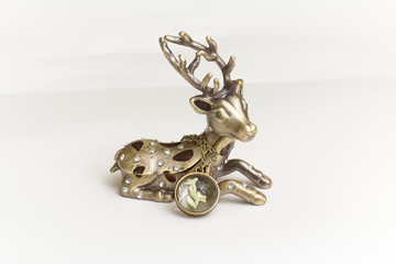 statuette of a deer on a white background