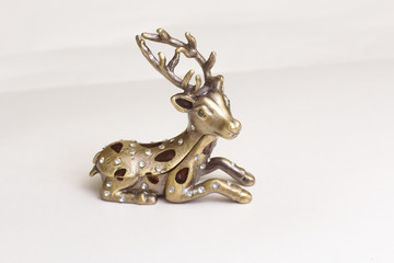deer figurine on white background