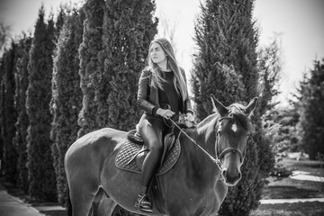 Spring - summer season, concept of hobby, Woman with a horse on a nature, relationship human and...