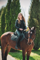 Spring - summer season, concept of hobby, Woman with a horse on a nature, relationship human and...