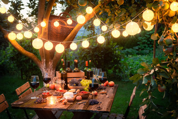 Fototapeta Rustic table with appetizers and wine in the evening obraz