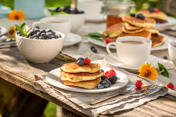 American pancakes with fresh blueberries and honey