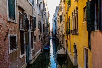 Fototapeta na wymiar Venice street scene with romantic building canal and gondolas
