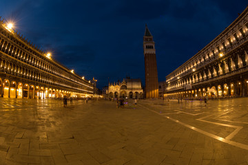 Fototapeta premium A view of St. Mark's Square with Campanile and Doge's Palace at sunset time